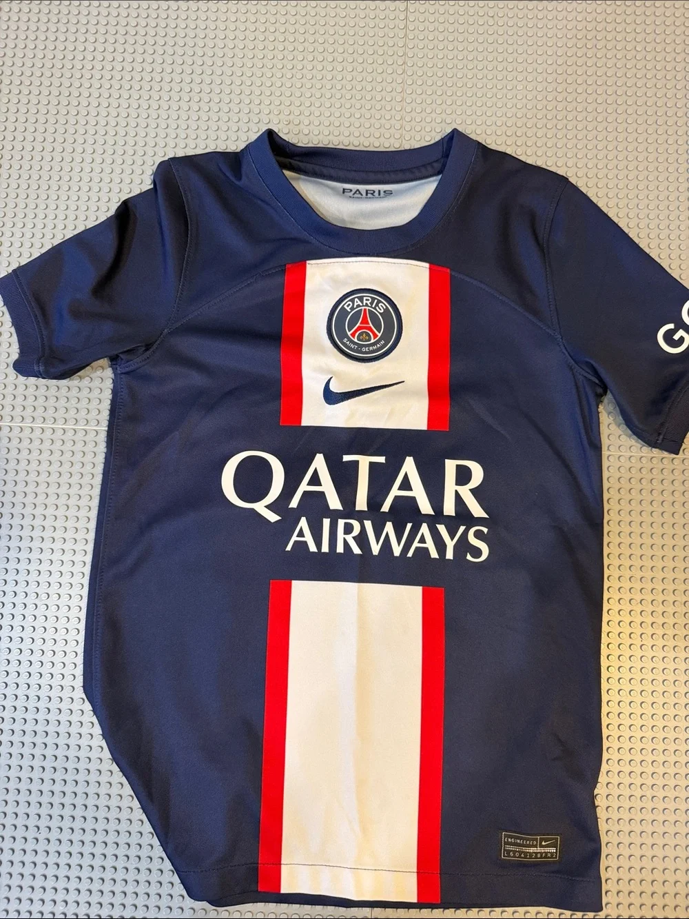 Nike Youth PSG Navy Soccer Jersey with White and Red Stripes